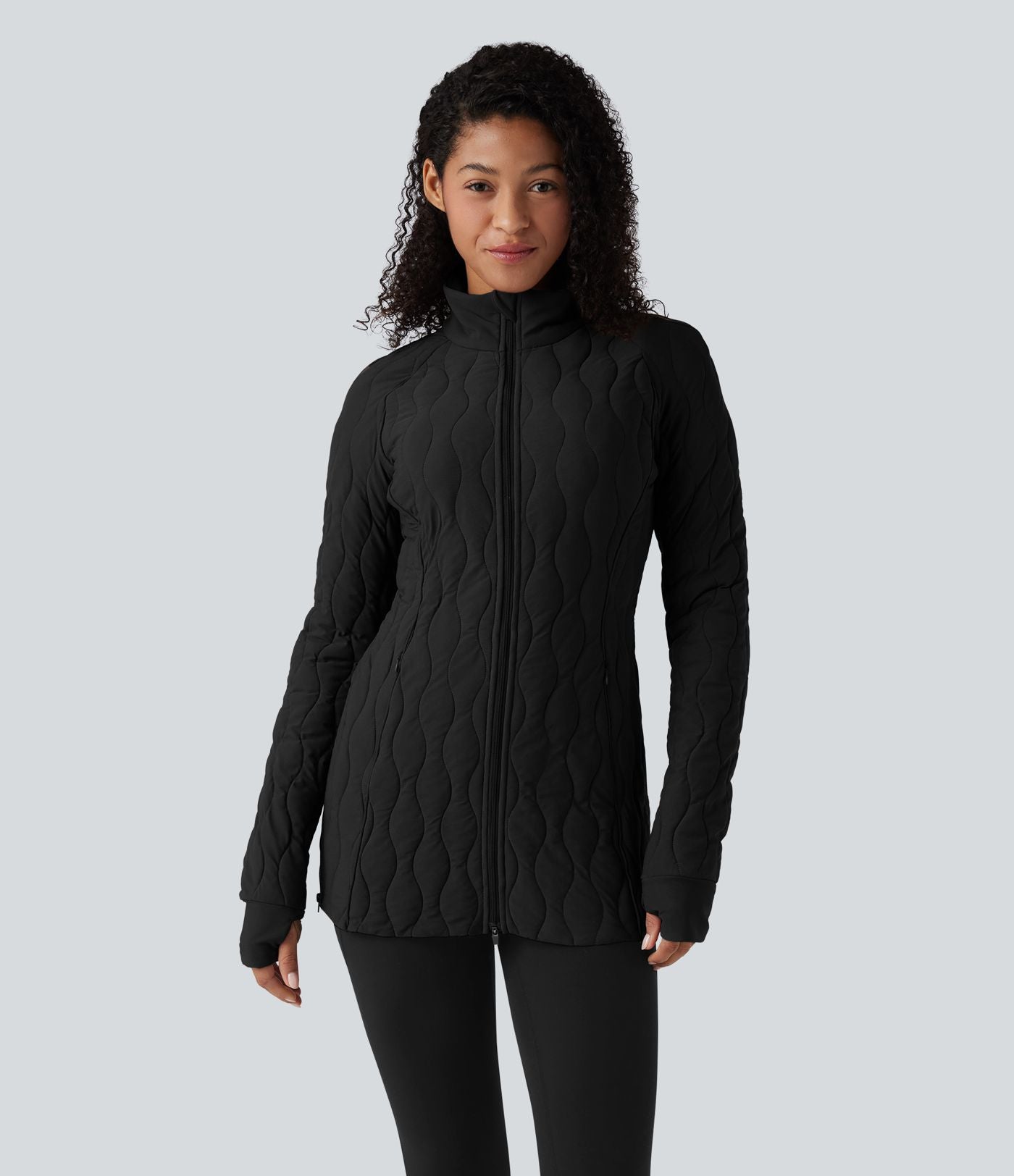 Veste matelassée de sport PuffFlex à col montant, manches longues, fermeture éclair avec passe-pouces et poches