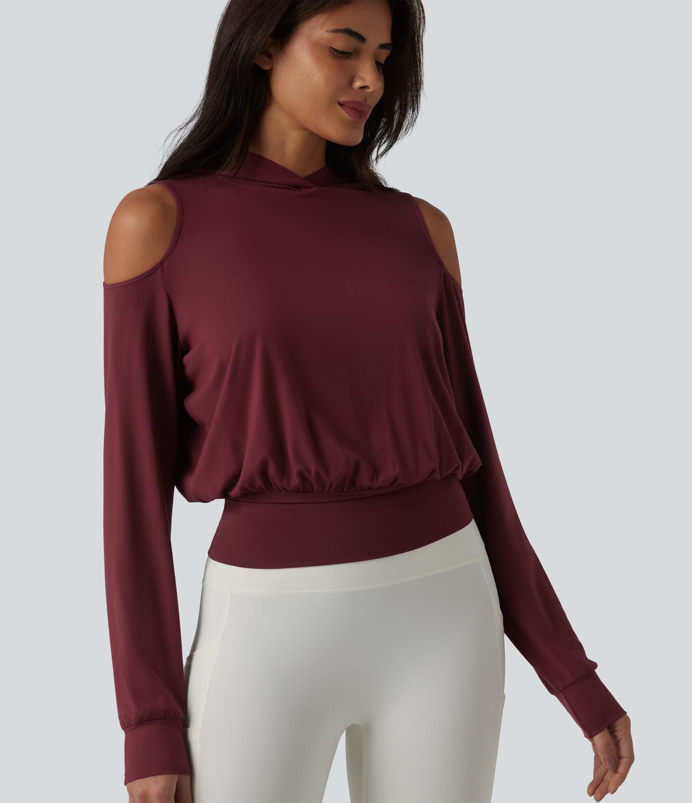 Sweat-shirt de sport à capuche épaules dénudées manches longues