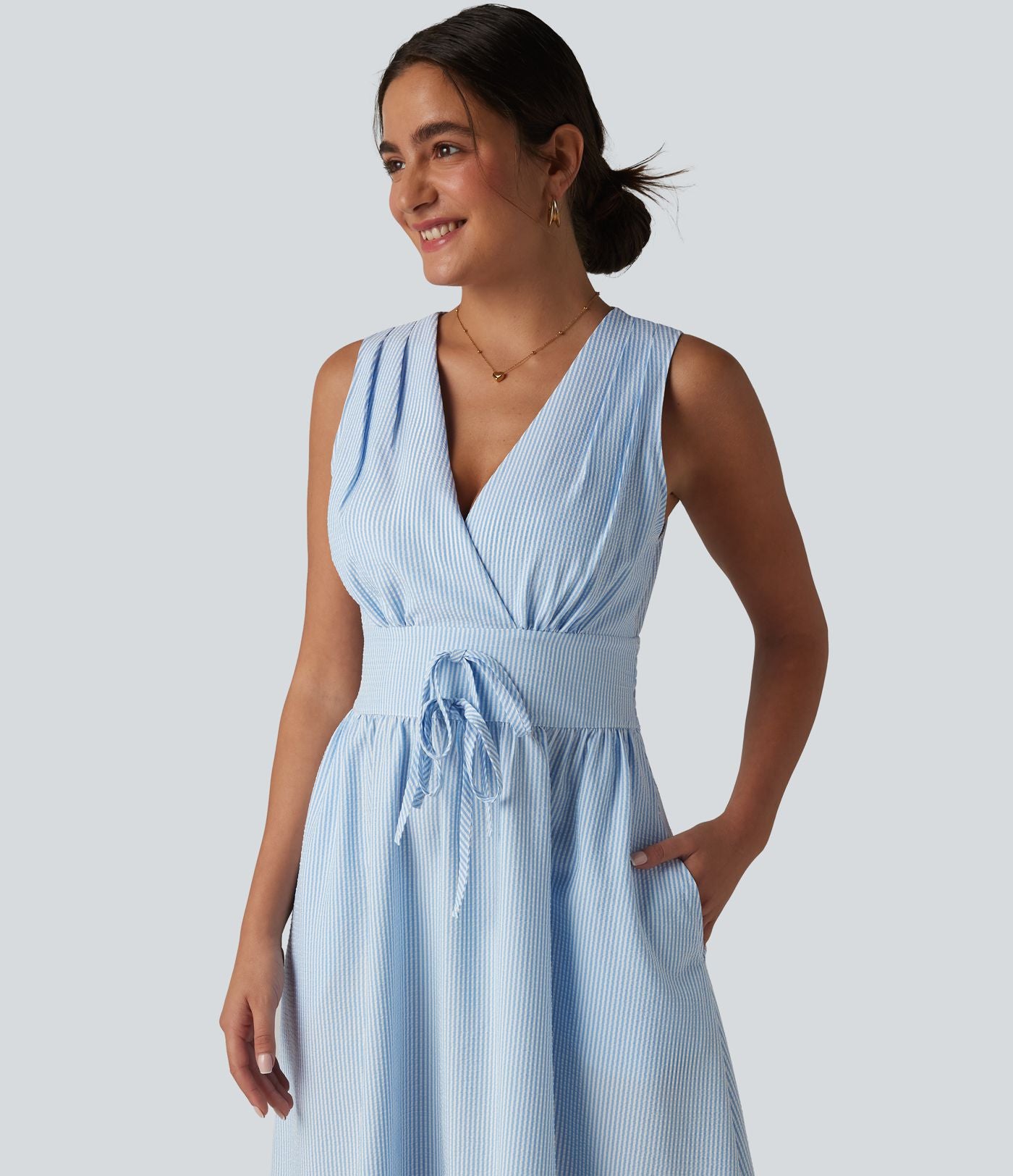 Robe midi rayée sans manches à col en V et poches