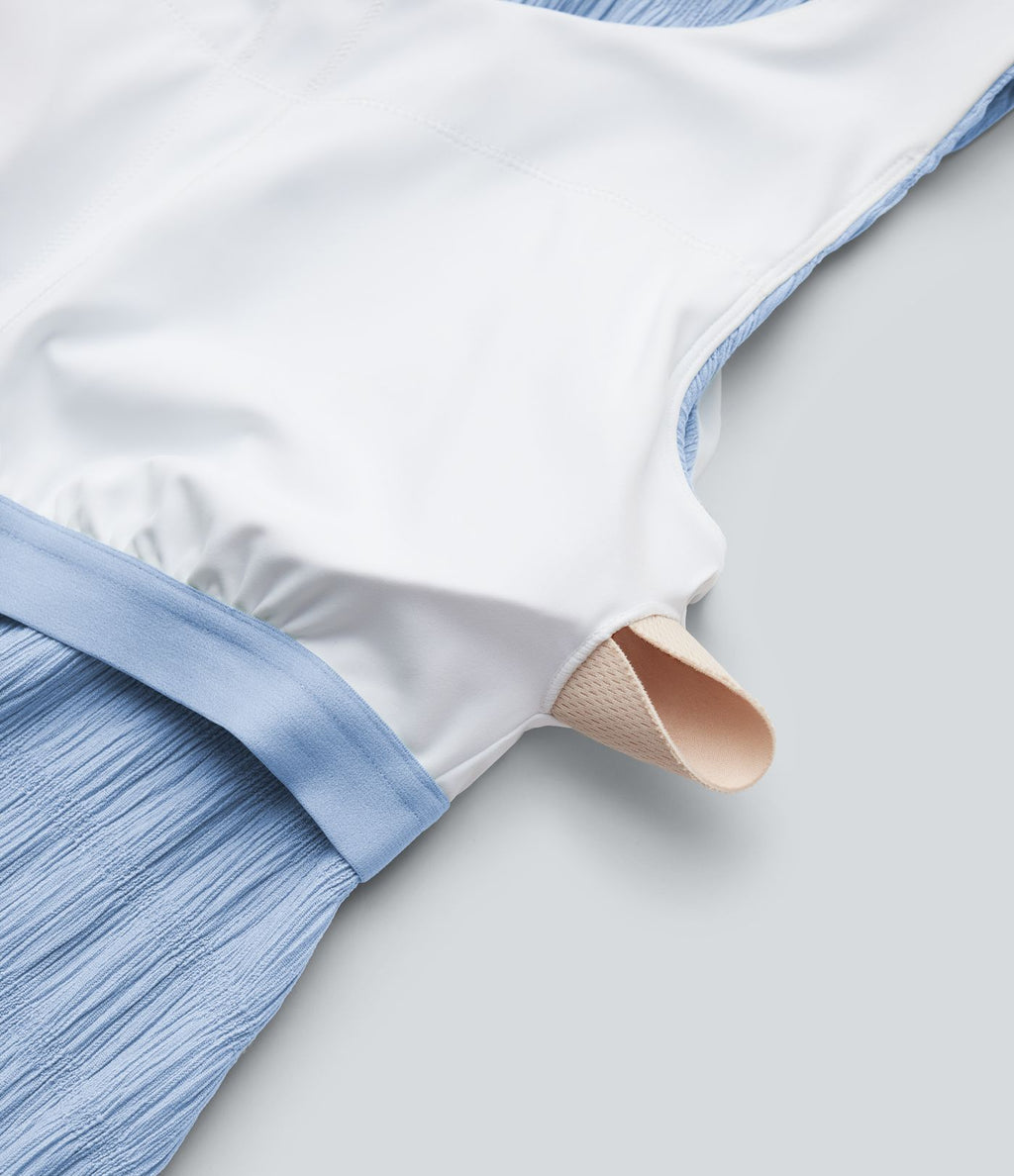Robe midi sans manches à encolure arrondie avec coussinets amovibles et ourlet à volants