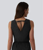 Robe mi-longue fluide col V sans manches avec nœud au dos