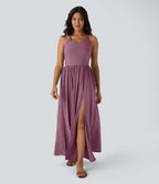 Robe longue fluide fendue avec poches latérales, dos nu et effet torsadé
