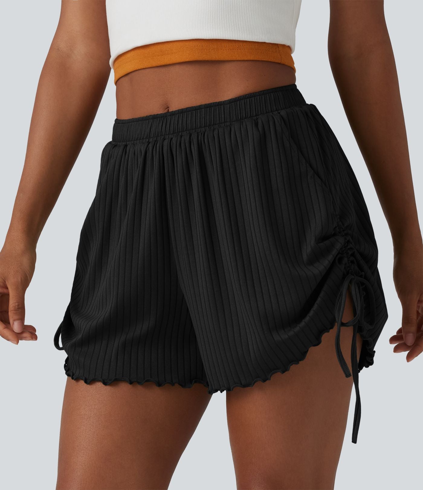 Short en maille côtelée taille mi-haute à cordon de serrage et ourlet ondulé 10 cm avec poches