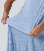 Robe midi sans manches à encolure arrondie avec coussinets amovibles et ourlet à volants