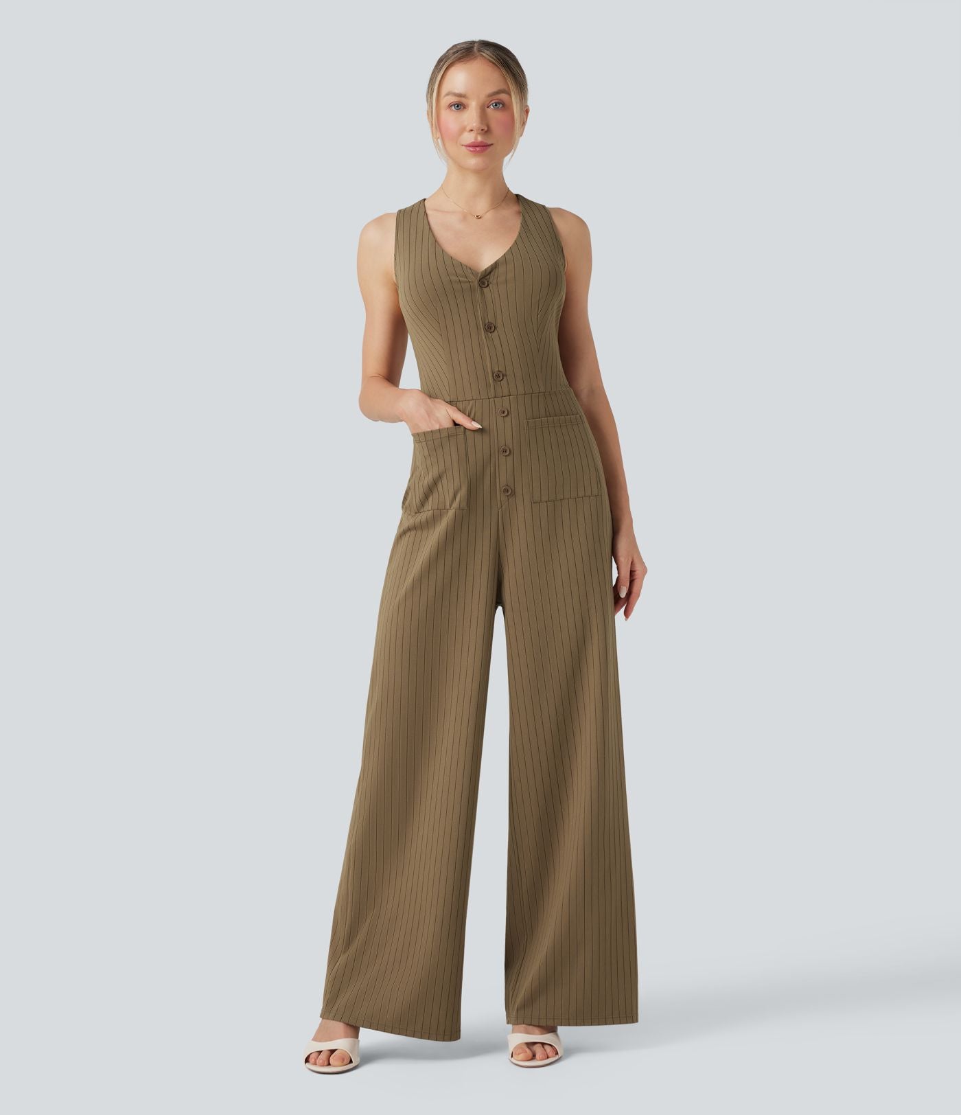 Combinaison tailleur rayée à jambes larges, décolleté en V, découpe et poches