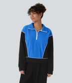 Sweat bicolore en polaire col montant avec demi-zip et manches longues