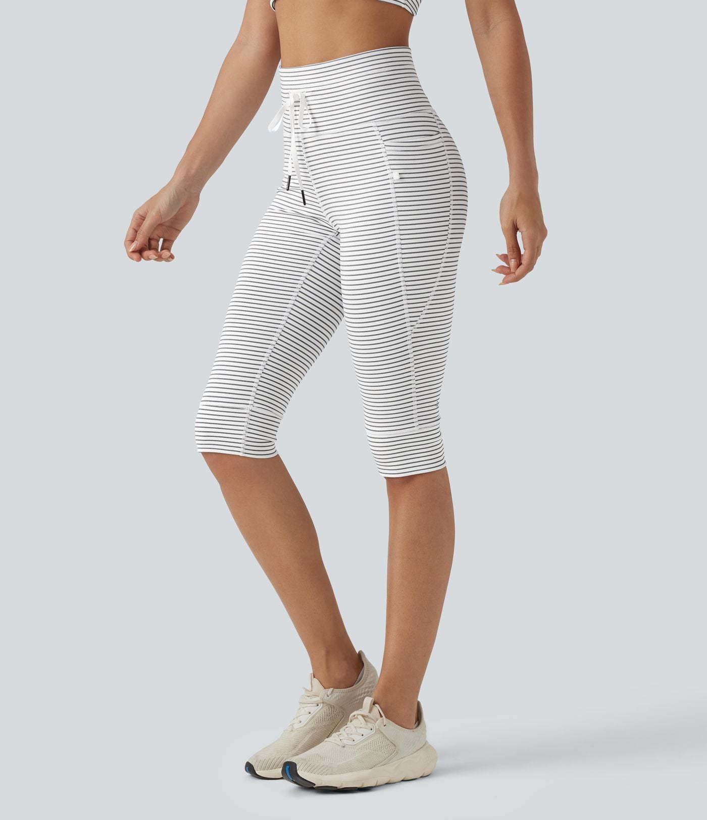 Legging 3/4 de yoga taille haute à rayures avec cordon de serrage et poches