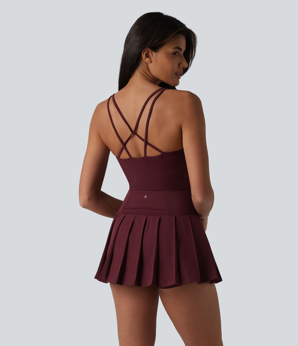 Robe sport mini 2-en-1 à bretelles col U, dos nu croisé, plissée à ourlet asymétrique, soutien-gorge intégré et poches