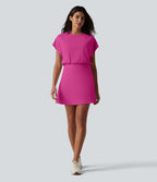 Robe de sport mini de yoga SoftlyZero™ Airy 2-en-1 effet frais InstantCool col rond à manches courtes, demi-zip et poches, accès facile Easy Peasy