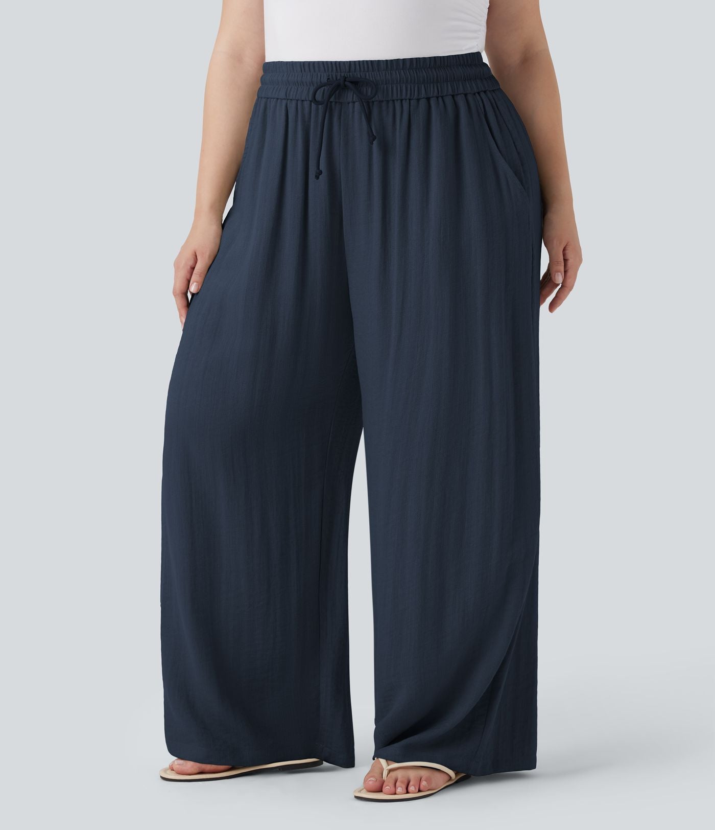 Pantalon décontracté grande taille large fluide taille haute effet lin avec cordon de serrage et poches