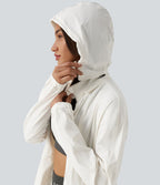 Veste de sport déperlante à capuche amovible avec cordon de serrage et poches zippées