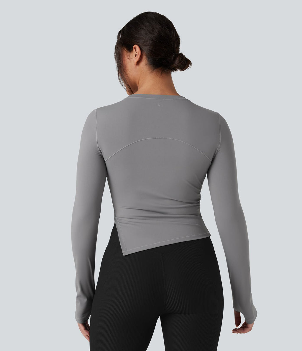 Top de sport yoga col rond ourlet asymétrique fendu manches longues avec trous pouces