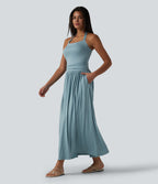 Robe longue fluide dos nu avec tour de cou, brassière intégrée et poches