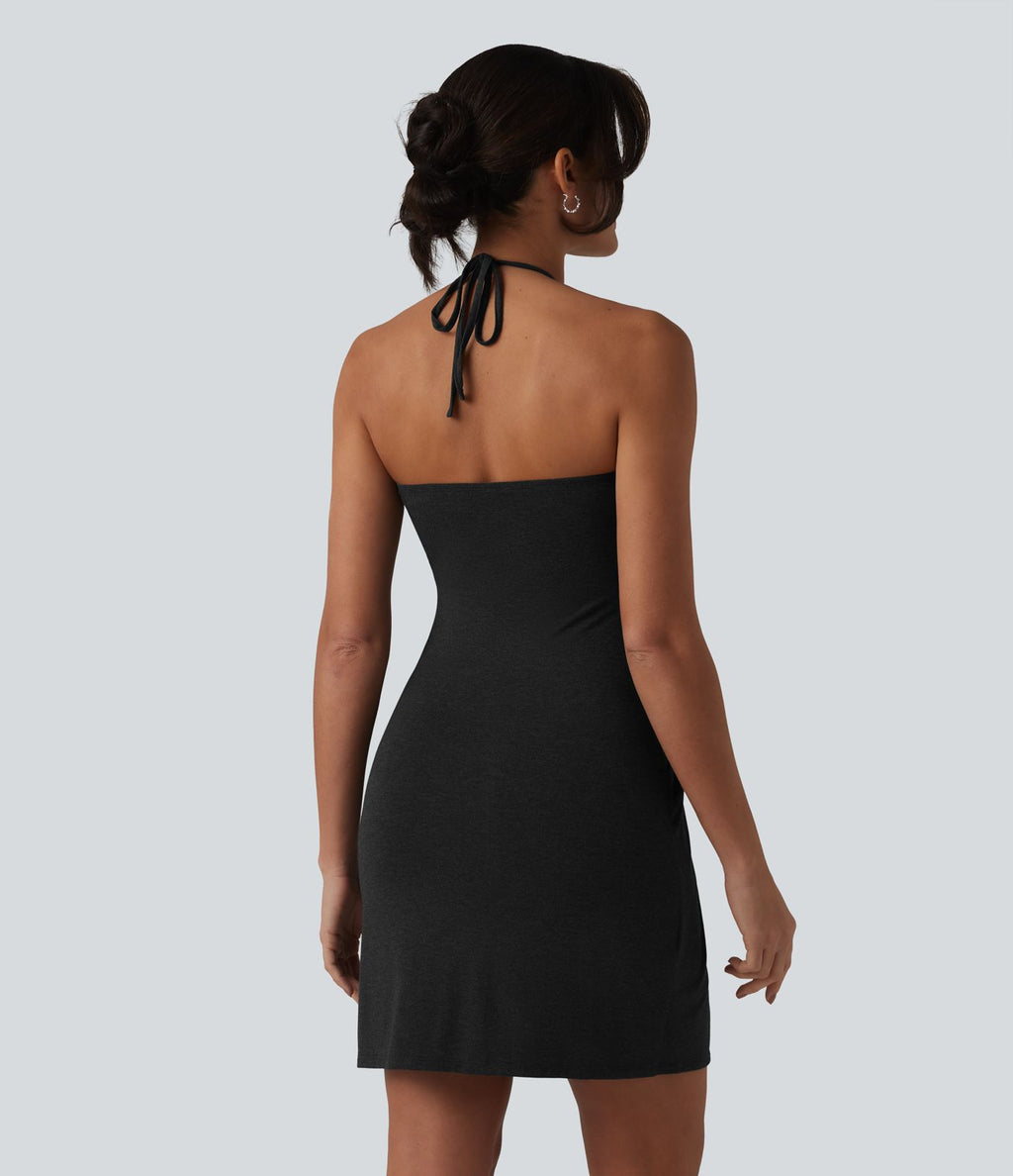 Robe resort mini dos nu à col licou avec lien noué dans le dos et poches