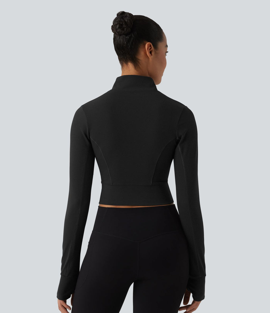 Haut de sport court col cheminée demi-zip manches longues avec passe-pouces