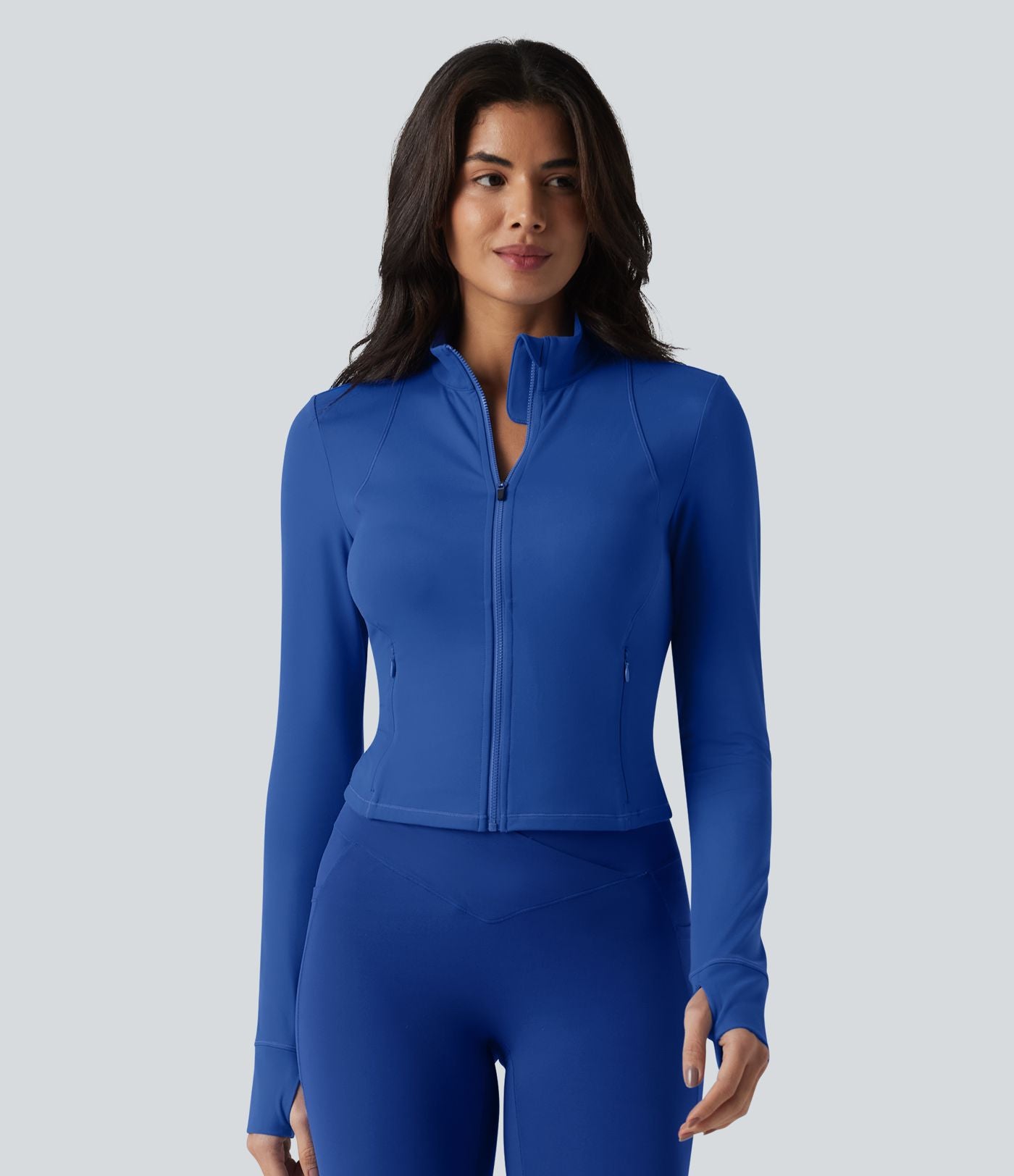 SoftlyZero™ Plush Veste de yoga col montant à manches longues avec trous pour les pouces, dos torsadé, empiècements en mesh respirant et poches