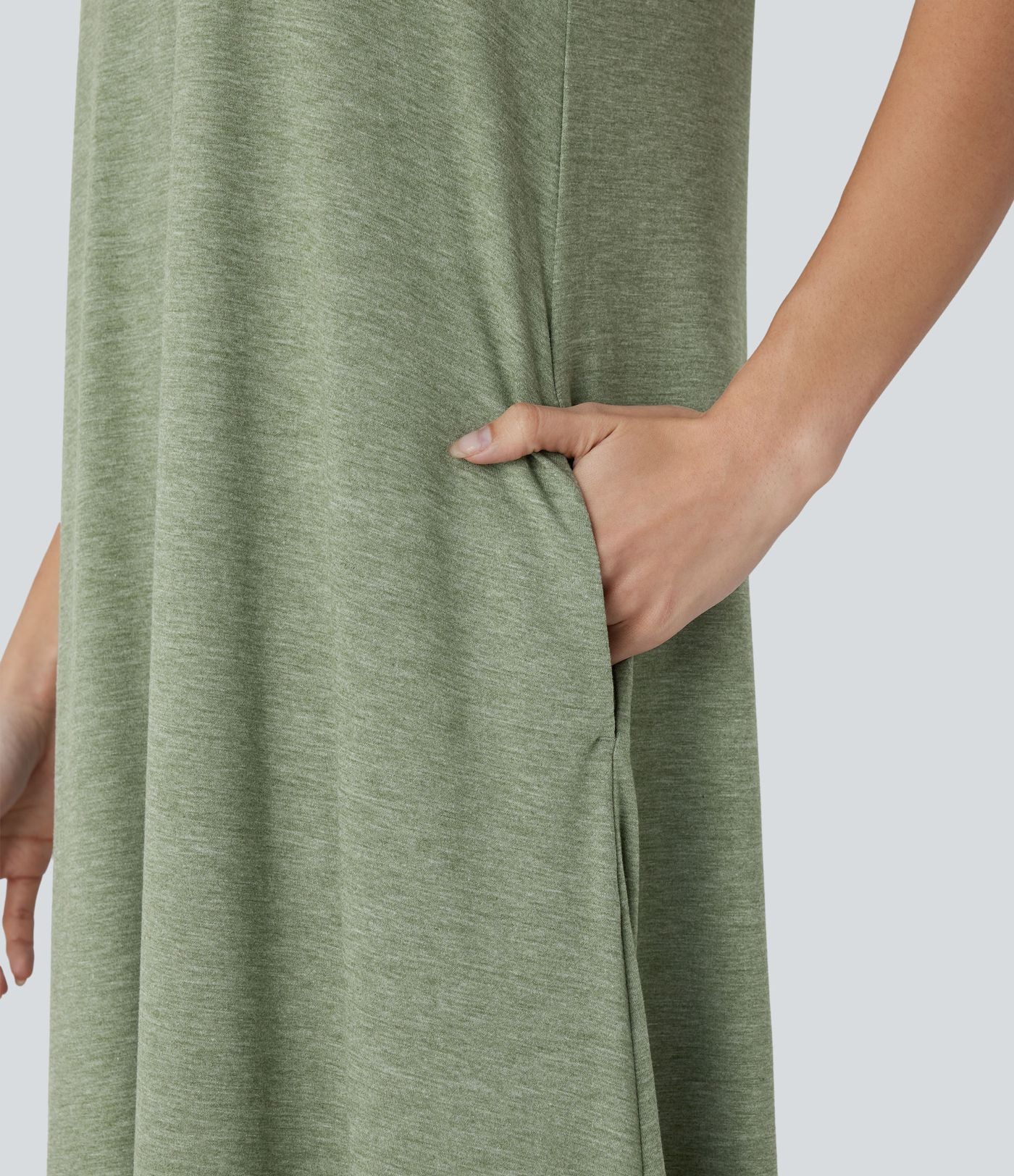 Robe longue décontractée fluide à col rond, sans manches, poches latérales et ourlet asymétrique