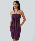 Robe mini de plage à col halter avec brassière intégrée, lien noué au dos et poches