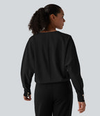 Blouse esprit bureau défroissage facile, col V, manches longues et boutons décoratifs