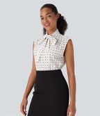 Chemise de travail sans manches à pois avec nœud devant