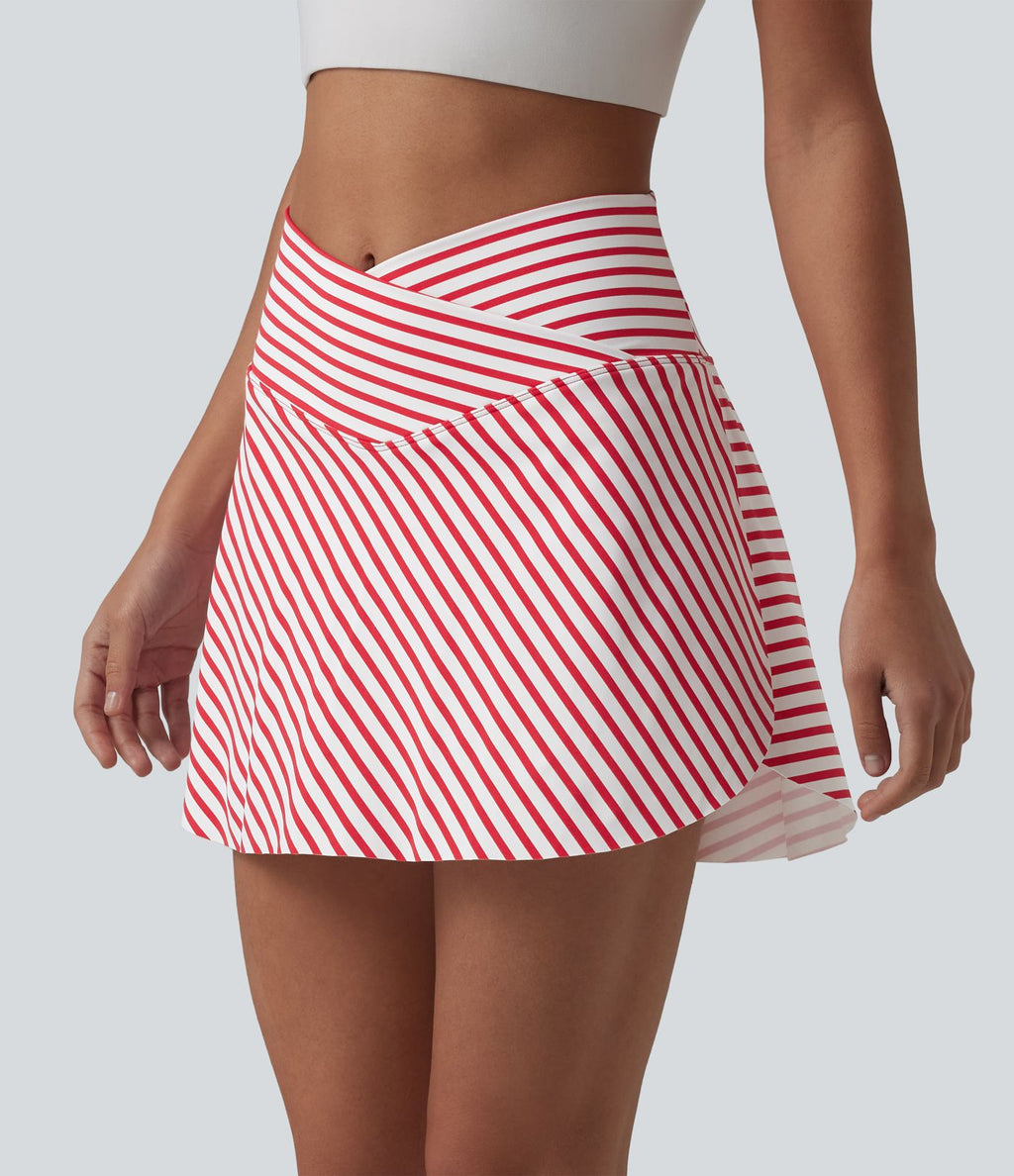 Jupe de tennis mini 2 en 1 à rayures, taille haute croisée, ourlet arrondi et poches