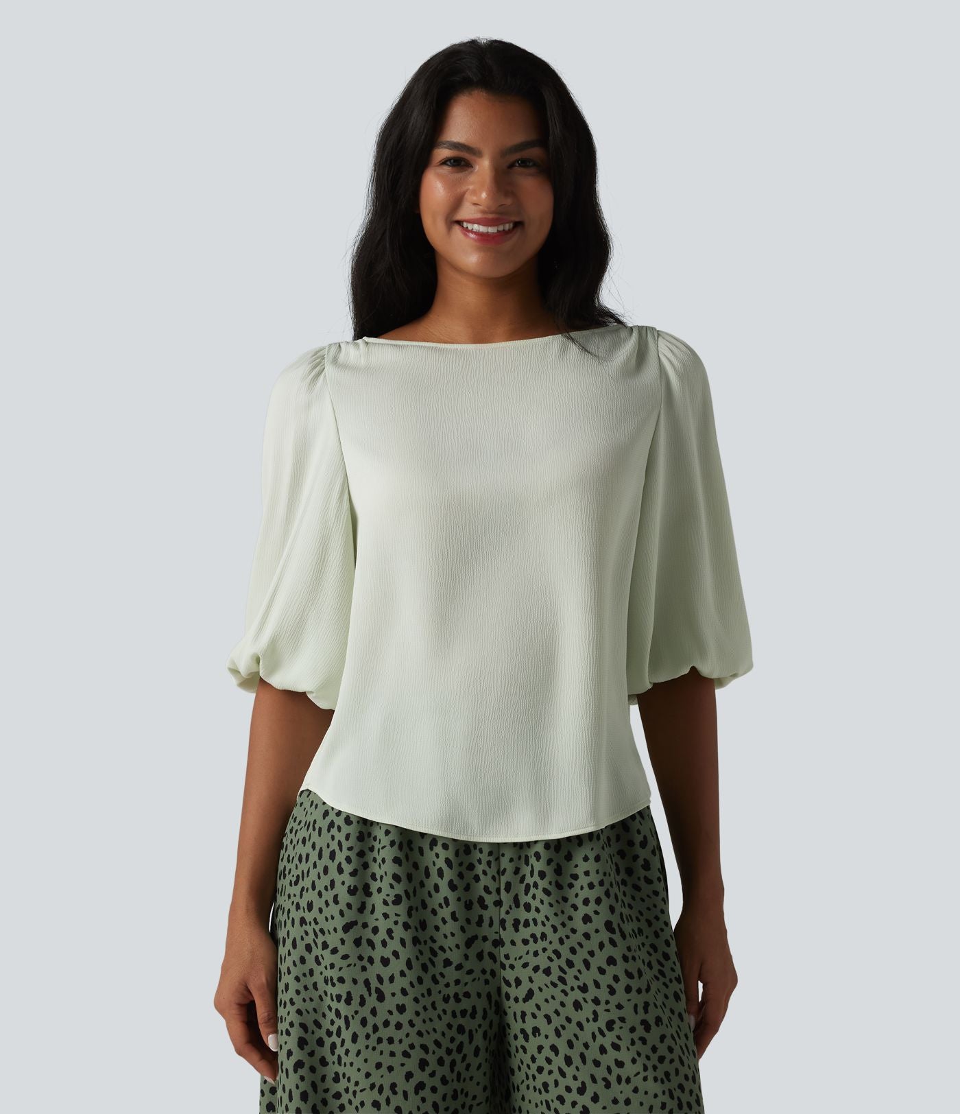 Blouse décontractée à manches bouffantes et ourlet arrondi texturé