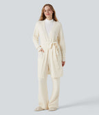 Robe d'intérieur longue tricot ouverte ceinturée manches longues avec poches
