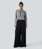 Blouse de travail à col montant, plis, boutons au dos et manches longues