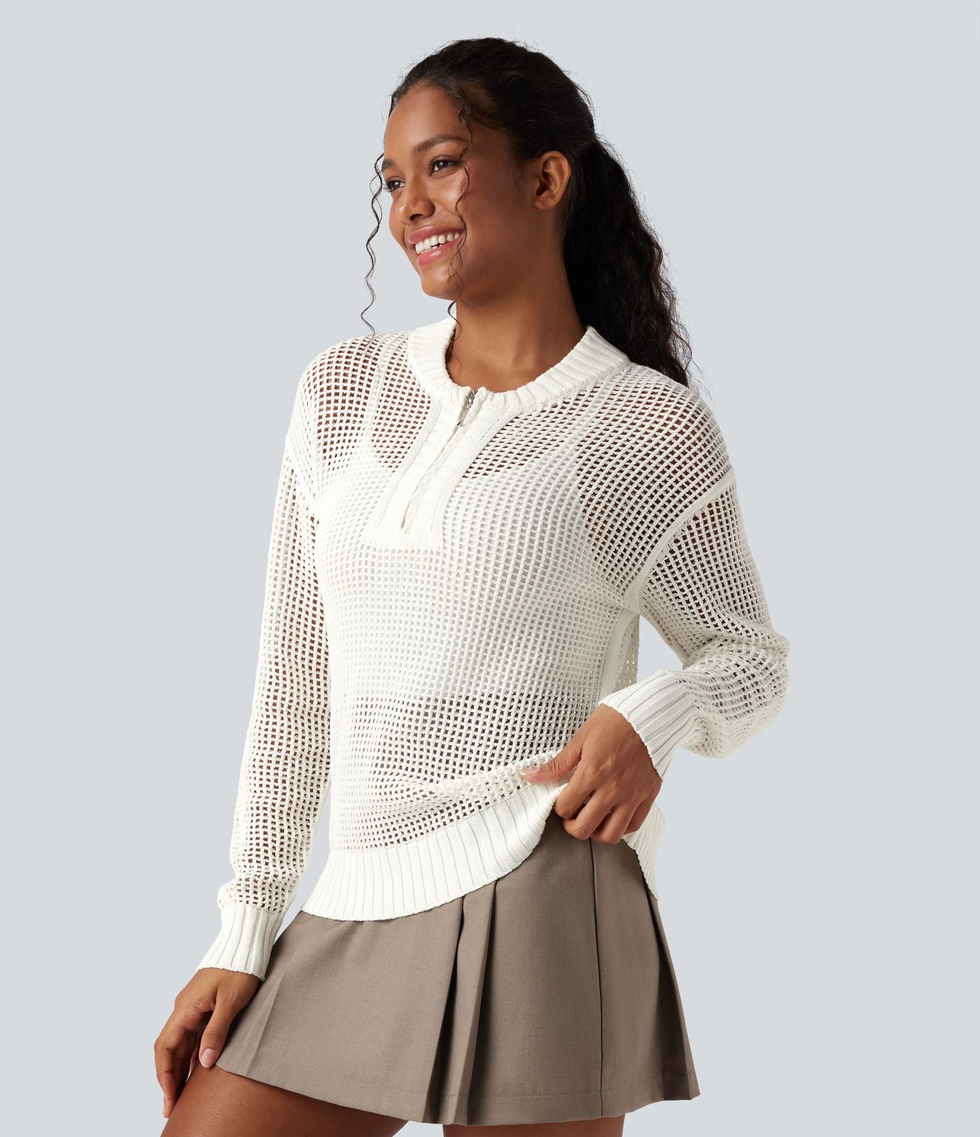 Pull ajouré demi-zip col rond manches longues