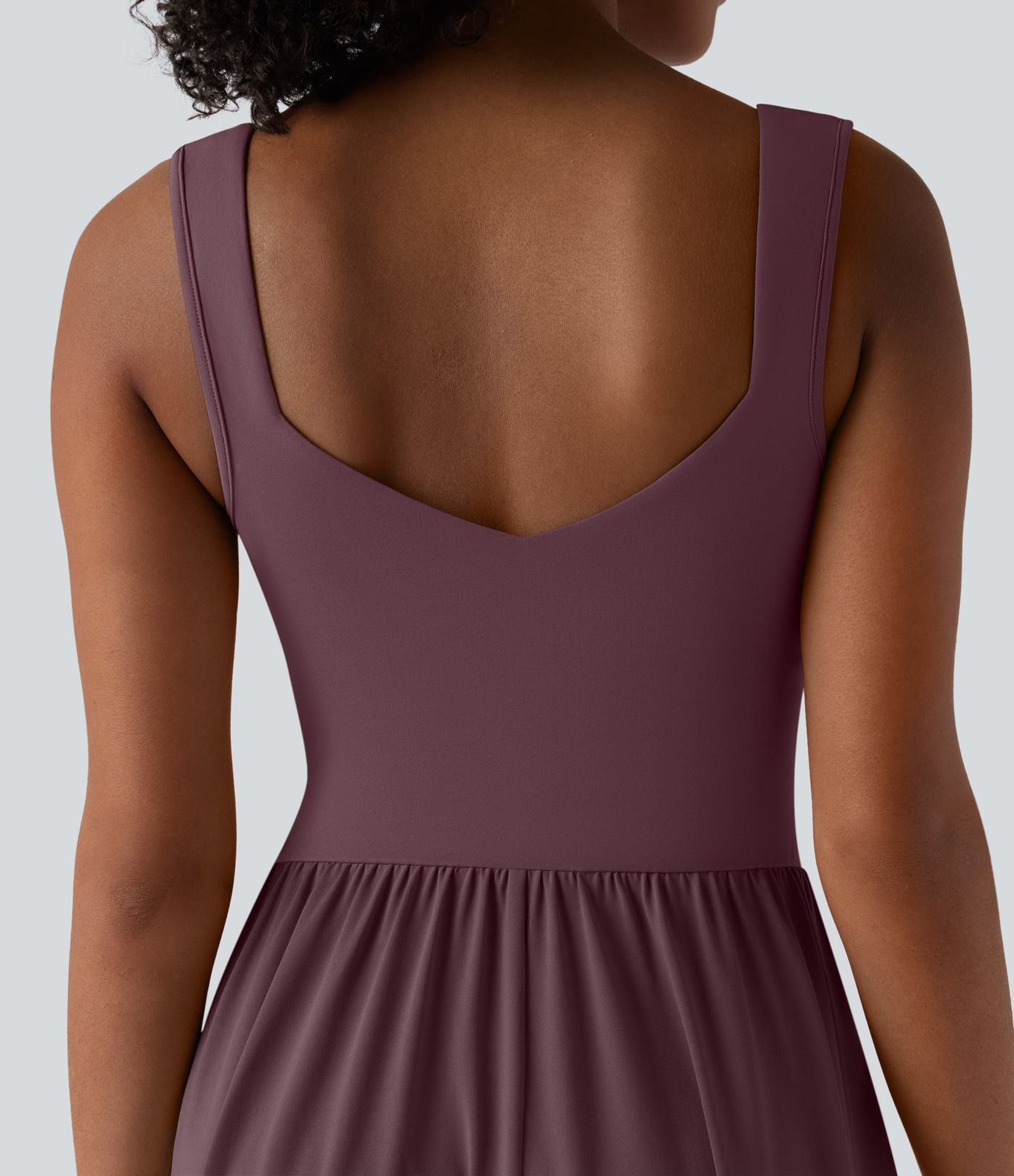 Robe midi fluide sans manches dos croisé ouvert avec poches